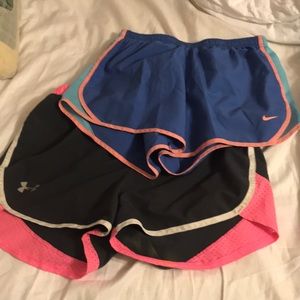 Two pairs of Nike and under amour athletic shorts